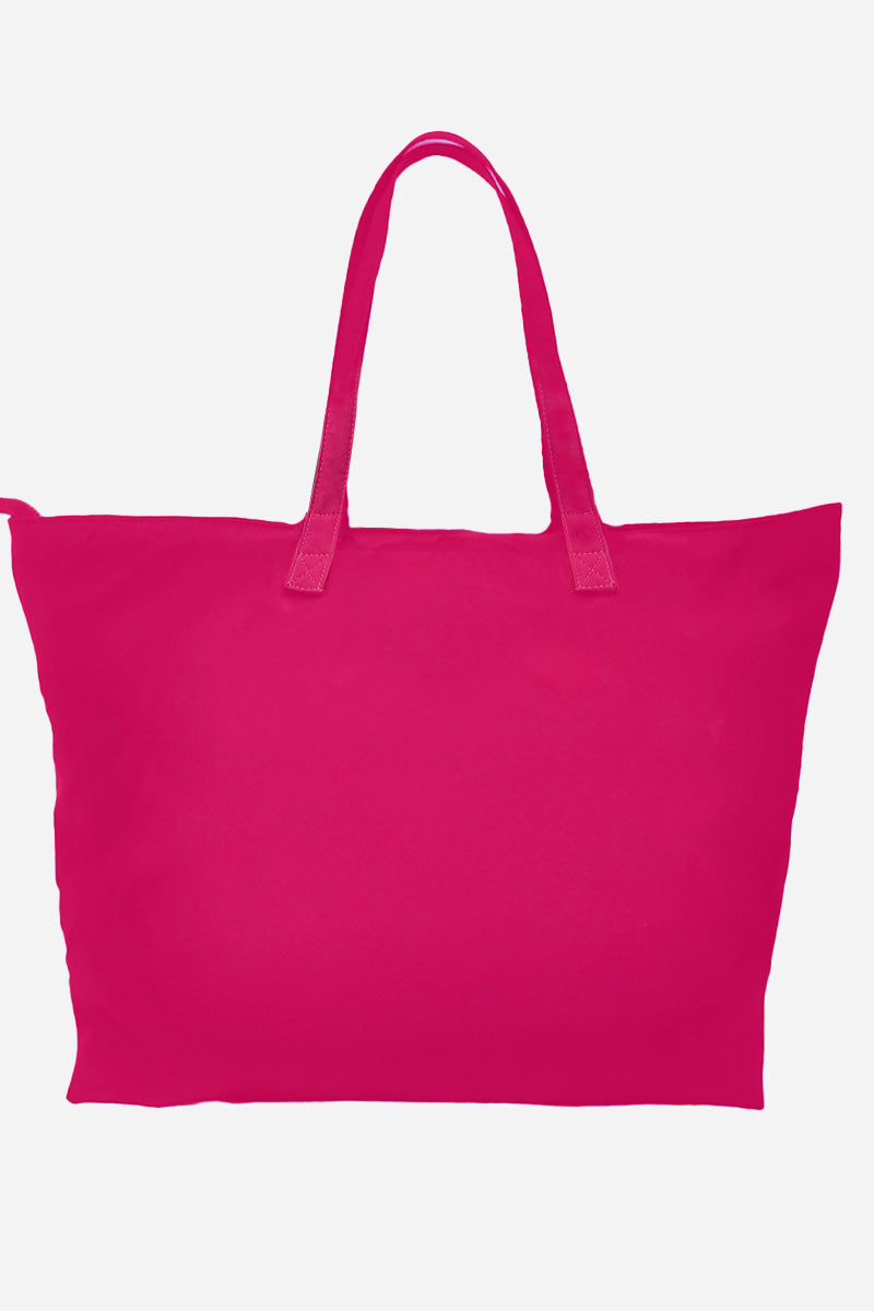 A large, vibrant Barbara Pink waterproof travel bag called "The One" by looselyboho is displayed against a plain white background. The bag features reinforced handles, a simple and unadorned design, and appears spacious.