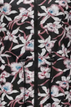 Close-up image of a polyester FLORALSHIFT COAT: THE REVERSIBLE RAINCOAT by looselyboho with a floral-patterned fabric. The design features pink and white flowers with blue centers on a black background. A black zipper and black drawstrings are visible in the center, along with deep pockets that add both functionality and style.