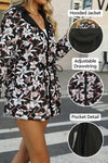 A person wearing a FLORALSHIFT COAT: THE REVERSIBLE RAINCOAT by looselyboho. The image includes close-up views of the hood, drawstring, and pocket in separate circular insets. The background shows an outdoor urban setting.